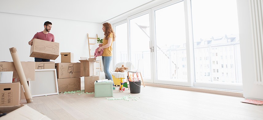 couple with moving boxes during first move